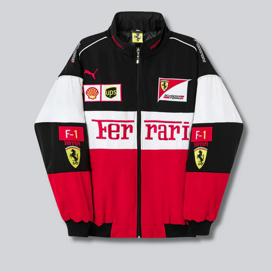 A vintage Ferrari bomber jacket with red, white, and black color blocks, featuring embroidery and patches including the Ferrari logo and the F1 flag.